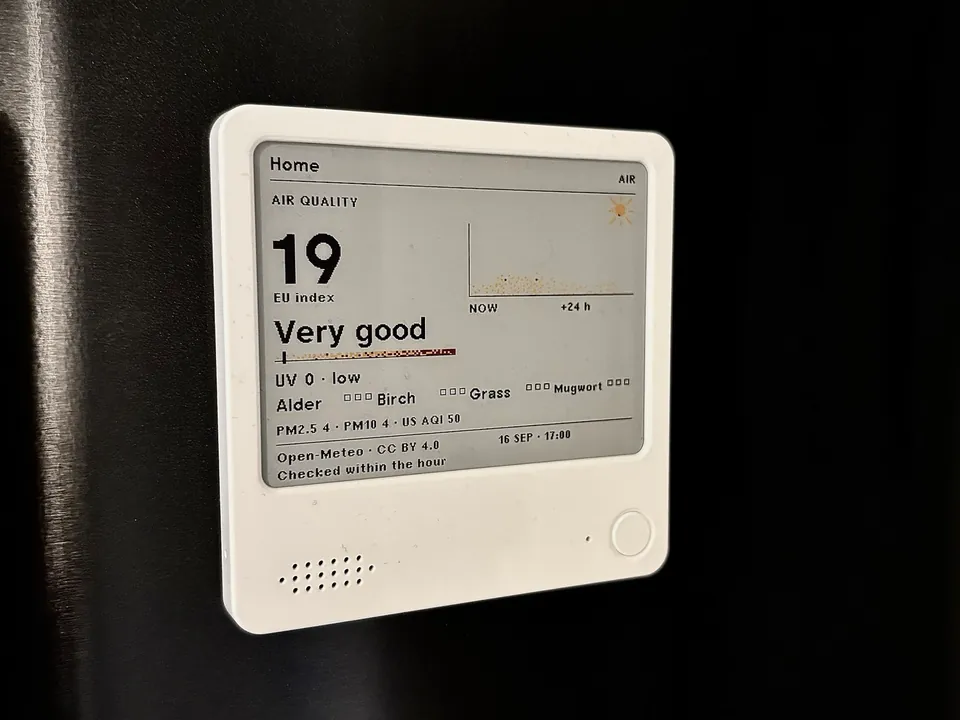 A ZECTRIX NOTE4C on a fridge door running emini Home 0.5.1. The Air screen shows a European index of 19, the word Very good, a 24-hour band of PM2.5 with a yellow sun above it, UV 0 and four pollen tiles.