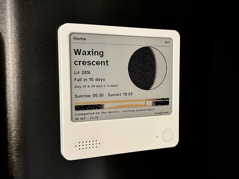The same NOTE4C showing the Sky screen in the Atlas composition: a large Moon drawn in dithered dots with a soft terminator, the words Waxing crescent, Lit 28%, Full in 10 days, and the sunrise and sunset times under it.